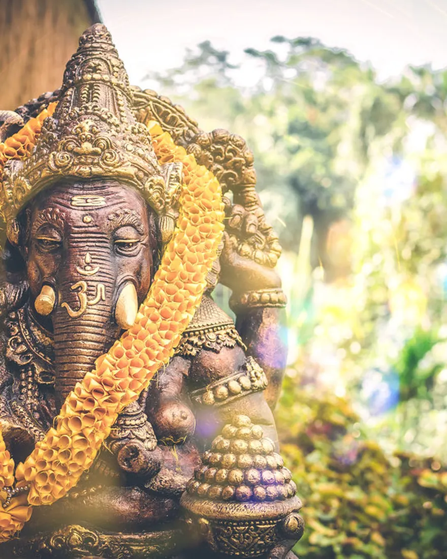 Garlanded Ganesha murti at the practice of Master Vishnu, Indian astrologer in Houston